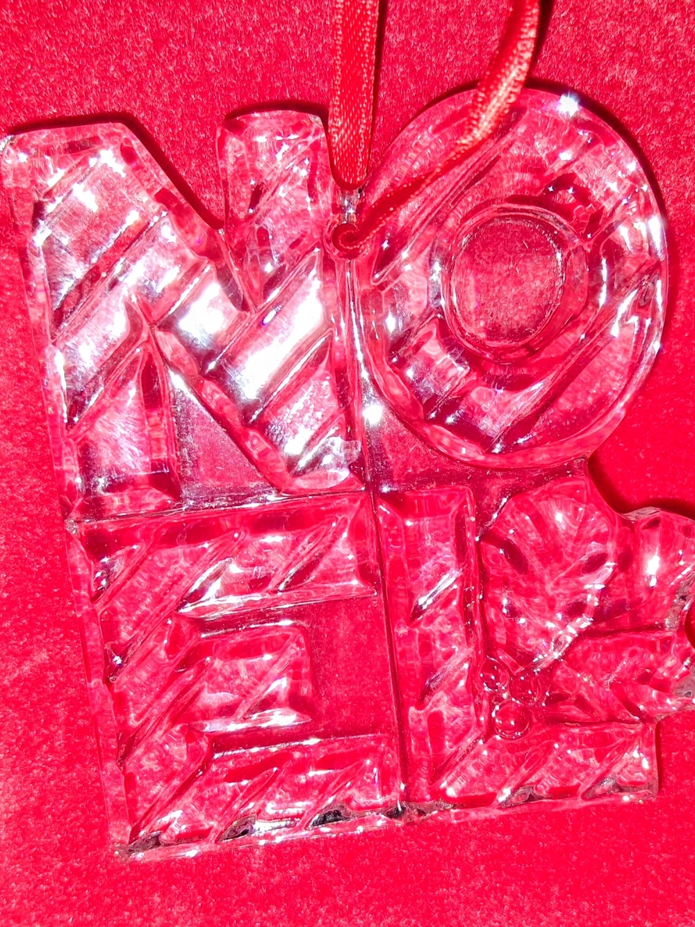 Lead crystal ornament titled 'NOEL' by Gorham